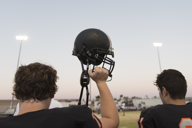 A Chaparral football team member raises their helmet prior to a game against Eldorado at Cha ...