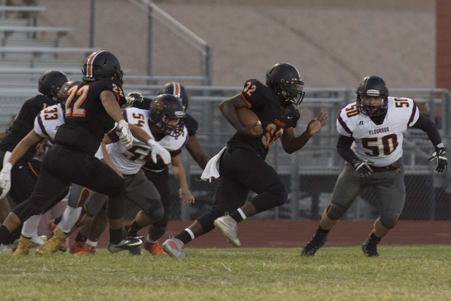 Chaparral’s Trayvius Hodge (32) runs with the ball during a football game against Eldo ...
