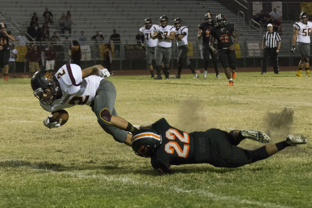 Eldorado’s Andres Jimenez (2) is tackled as he runs with the ball during a football ga ...