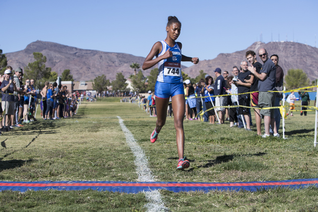 Alexis Gourrier from Centennial High School finishes first during the women’s junior-s ...