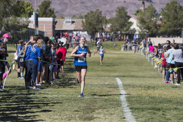 Olivia Weston runs towards the finish line during the women’s junior-senior race at Fo ...