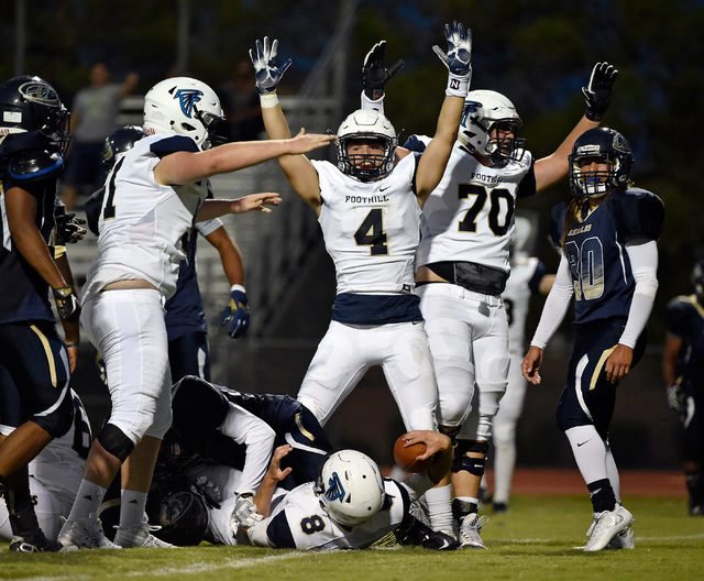 Foothill’s Jared Ables (4) celebrates a touchdown after Blake Wilson (8) crosses the g ...