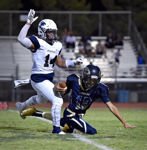 Cheyenne quarterback Matthew LaBonte (12) is sacked by Foothill’s Dylan Aguirre during ...