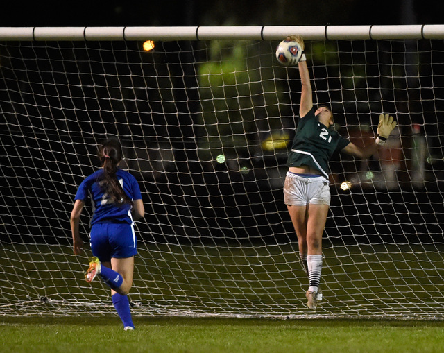 Palo Verde goalkeeper Kailee Barnhard blocks a shot from Reno’s Shelby Clayton during ...