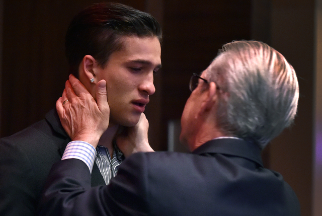 Biaggio Ali Walsh, left, is comforted by his father Bob Walsh as he remembers his grandfathe ...