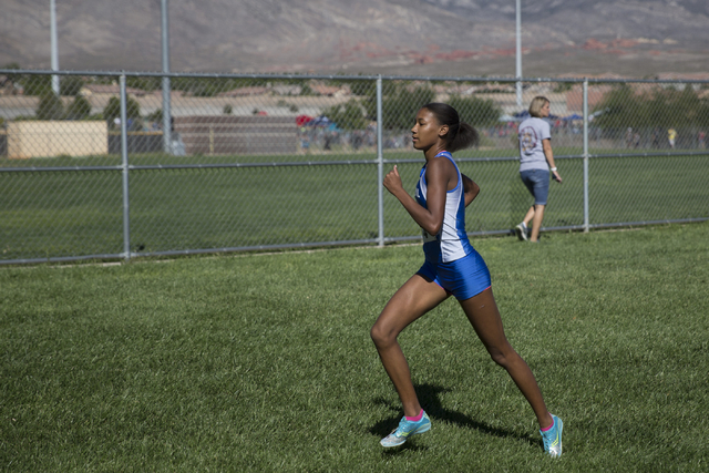 Centennial’s Alexis Gourrier, who finished in first place, runs in the cross country g ...