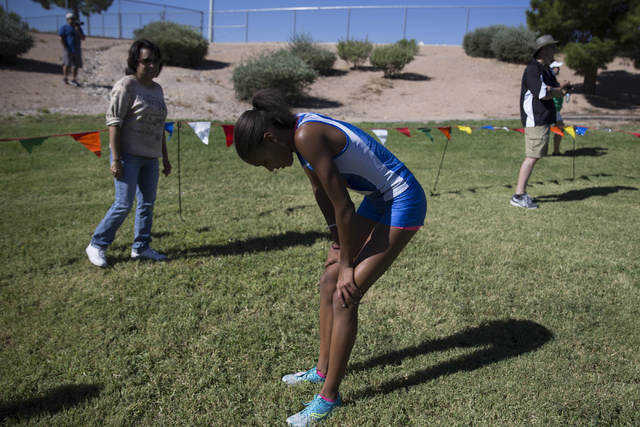 Centennial’s Alexis Gourrier catches her breath after finishing first in the cross cou ...