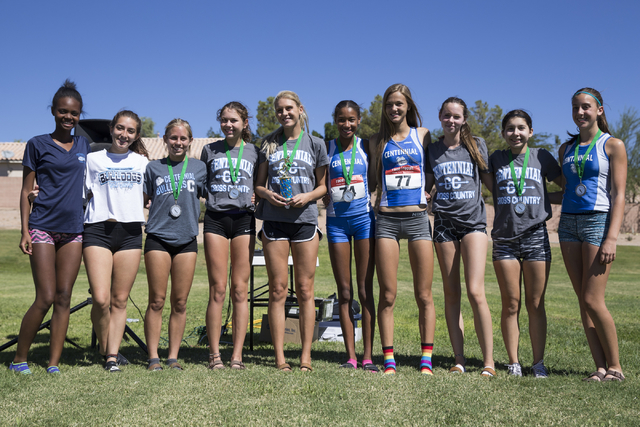 Centennial’s girls varsity cross country team is photographed after taking first place ...