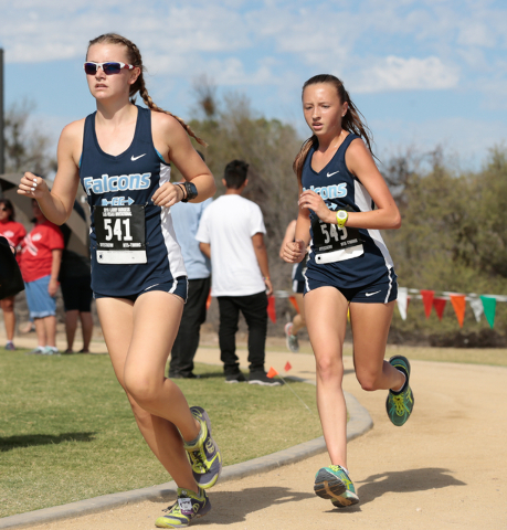 Foothill High School cross country team members Erica Schulz (541) and Erica Williams (545) ...