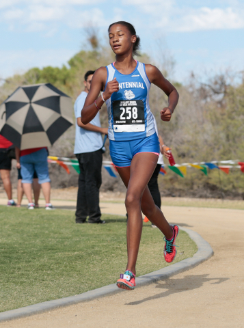 Centennial High School cross country runner Alexis Gourrier (258) is shown leading the varsi ...
