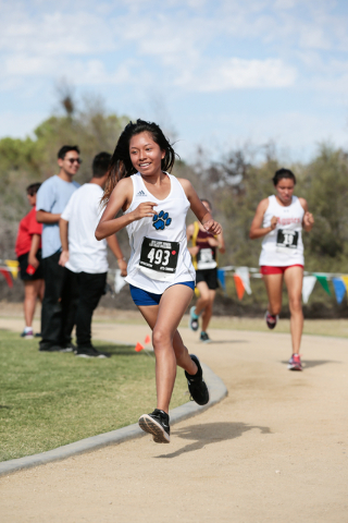Desert Pines High School cross country runner Nayeli Perea-Barco (493) makes her way around ...