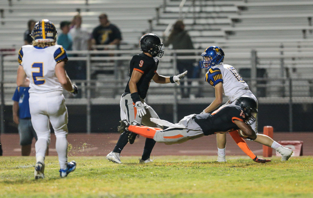 Chaparral junior Tyray Collins (19) dives across the goal line for a touch down during a fo ...