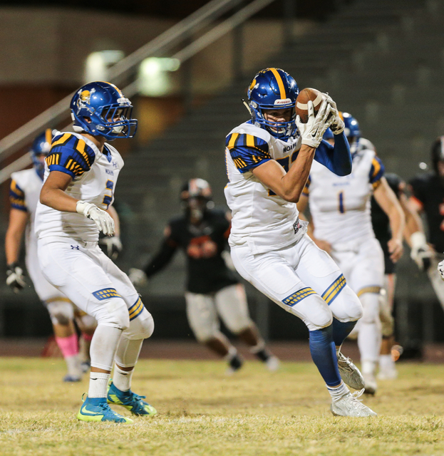 Moapa Valley sophomore Derek Reese (23) comes away with an interception during a football ga ...