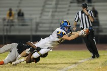 Moapa Valley senior Dayton Wolfley (10) stretches out with the ball over the goal line for a ...