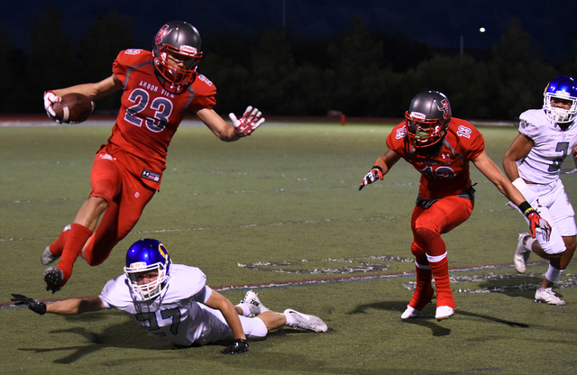 Arbor View’s Deago Stubbs (23) runs the ball against Orem’s defense during their ...