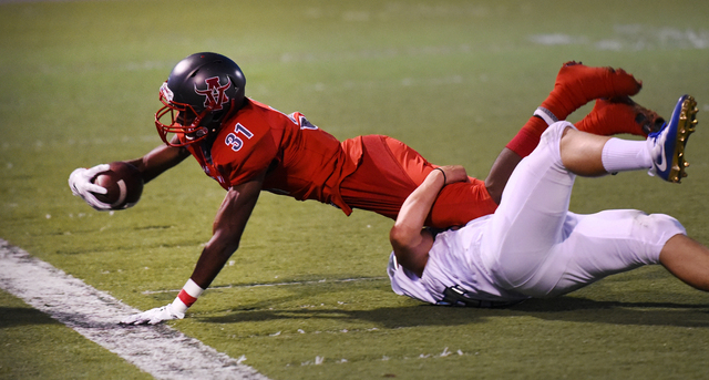 Arbor View’s Isiaiah Herron (31) is tackled by Orem’s defense during their footb ...