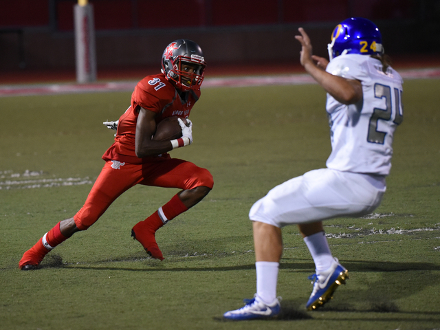 Arbor View’s Isiaiah Herron (31) runs the ball against Orem’s defense during the ...