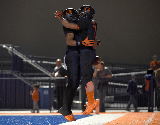 Bishop Gorman’s Biaggio Ali Walsh, right, and Dorian Thompson-Robinson celebrate a tou ...