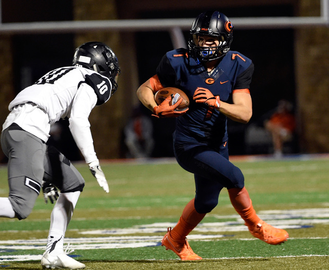 Bishop Gorman’s Biaggio Ali Walsh (7) carries the ball against Palo Verde’s Earn ...