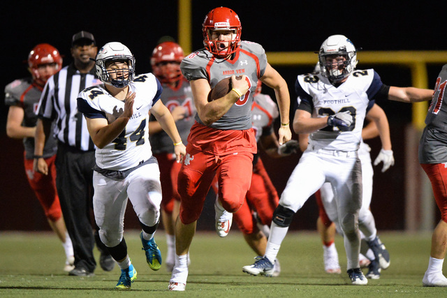 Arbor View quarterback Hayden Bollinger (18) runs the football during the Arbor View High Sc ...