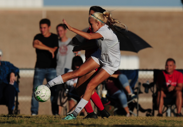 Palo Verde defender Katelyn Fann passes the ball away from Arbor View midfielder Ashley Kris ...