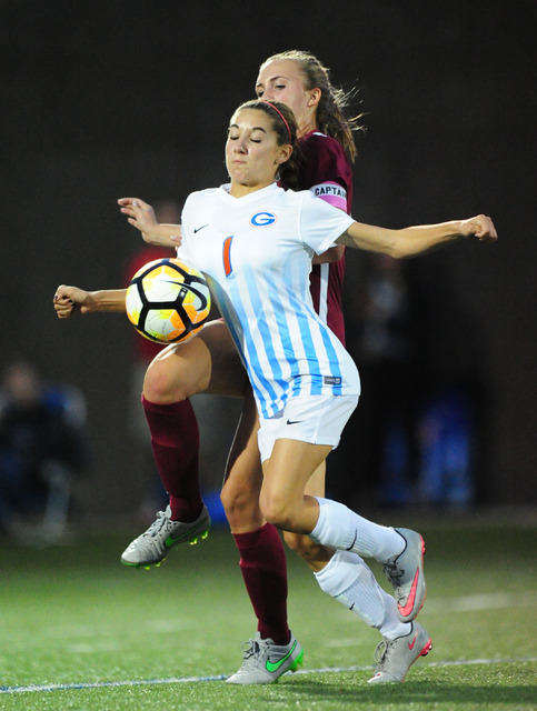 Bishop Gorman midfielder Jaden Terrana (1) and Desert Oasis defender Neva Newling fight to a ...