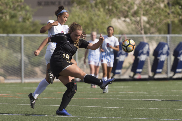 Faith Lutheran’s Brooke Nigro (18), kicks the ball during a girls soccer game at Bisho ...