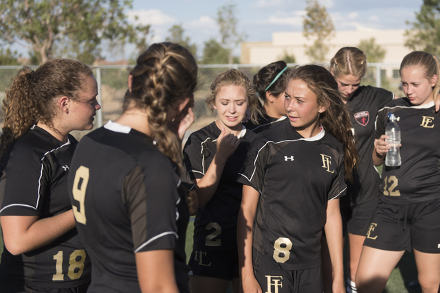 Members of the Faith Lutheran girls soccer team gather following a game at Bishop Gorman in ...
