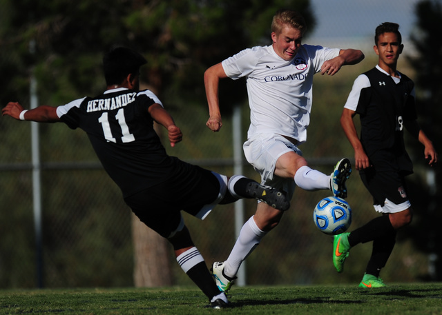 Las Vegas’s Agustin Hernandez (11) attempts a shot on goal while Coronado’s Patr ...