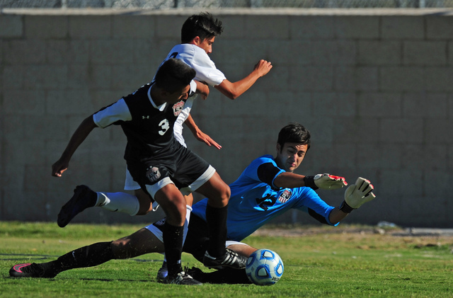 Las Vegas goalkeeper Mason Essary (12) makes a save off of Coronados’ Alfredo Diaz whi ...