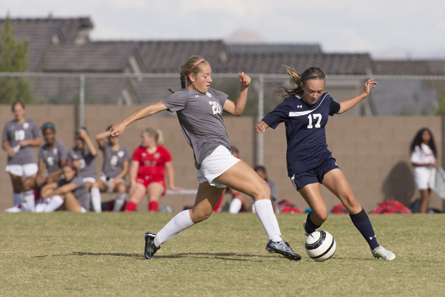 Centennial’s Katelyn Levoyer (17) fights for the ball with Arbor View’s Allyssa ...