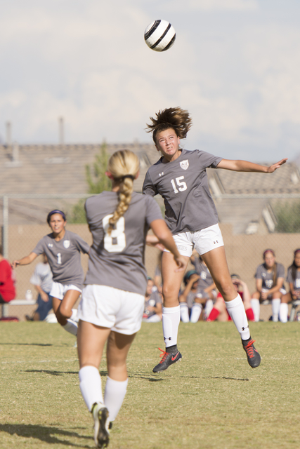 Arbor View’s Jolie Meyers (15) heads the ball during a girls soccer game against Cente ...