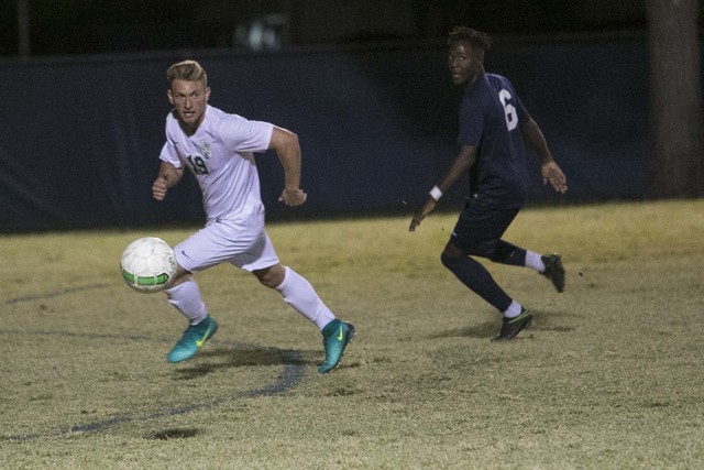 Green Valley midfielder Alessandro Sanchez (19) drives the ball past Foothill’s Reaga ...