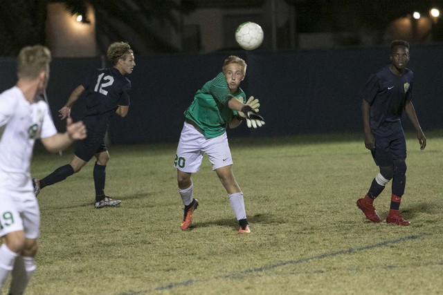 Green Valley goalkeeper Deven Scott (20) throws the ball to a teammate during a varsity socc ...