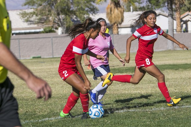 Western’s Ellyson Reynada (2) passes to teammates Vanessa Margarito (8) during a varsi ...