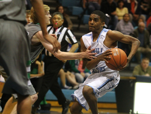 Foothill’s Jalen Shepard (1) tries to drive past Green Valley’s Troy Cropper on ...