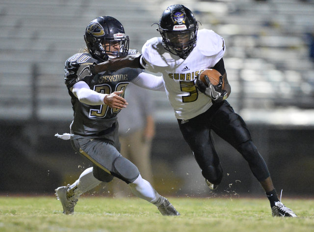 Sunrise Mountain receiver Xavier Kyle (5) breaks a tackle to score a touchdown during the Ch ...