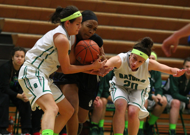 Green Valley’s Milena Palor, left, and Rianna Rudolph go for the ball against Basic&#8 ...