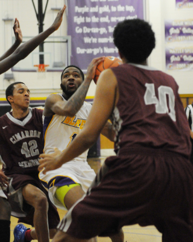 Durango’s Darryl Gaynor (13) looks for an opening against Cimarron-Memorial’s La ...