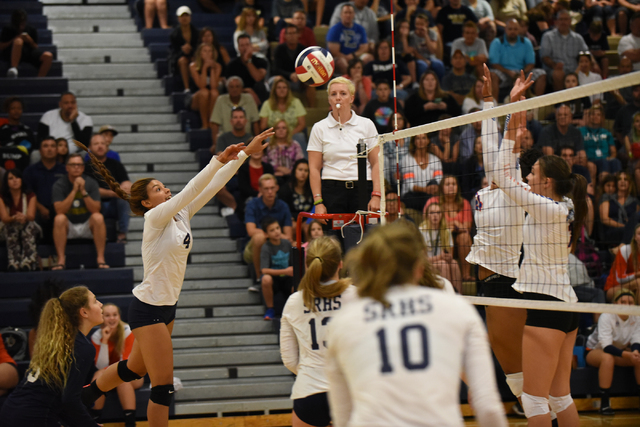 Shadow Ridge’s Kizzy Arroyo (4), left, volleys the ball against Bishop Gorman defender ...