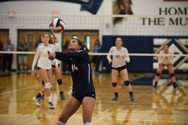 Bishop Gorman’s Alysia Neilson (14) digs the ball against Shadow Ridge’s offense ...