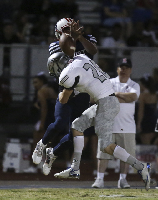 Green Valley defensive back Brant Hershberger (20) breaks up a pass intended for Liberty wid ...