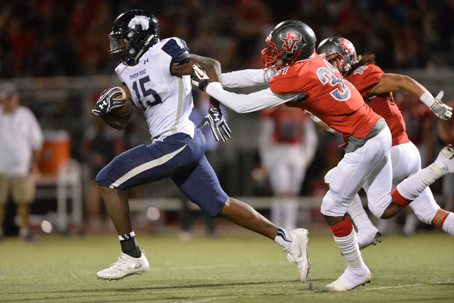 Shadow Ridge running back Malik Lindsey (15) runs the football during the Arbor View High Sc ...