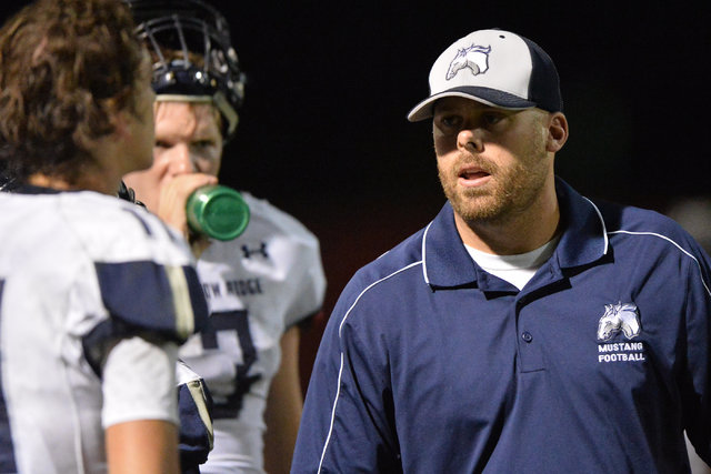 Shadow Ridge head coach Travis Foster walks the sidelines of the Arbor View High School Shad ...