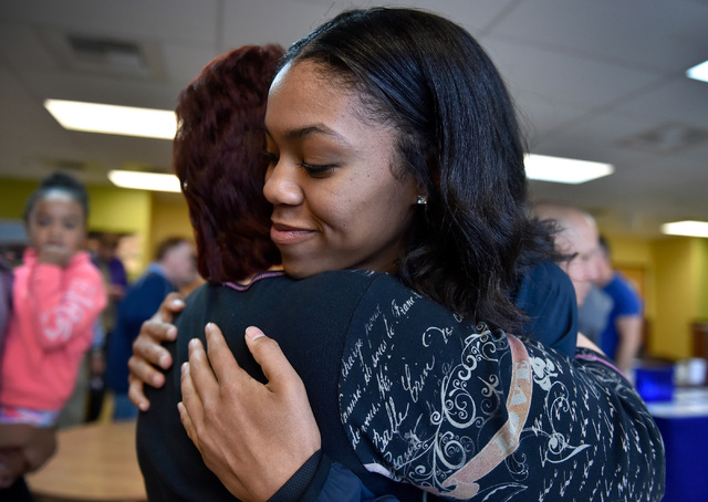 Bishop Gorman high jumper Vashti Cunningham, right, receives a hug from Cheryl Kuchka after ...