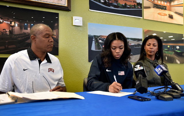 Bishop Gorman high jumper Vashti Cunningham, between her father, Randall Cunningham, left, a ...