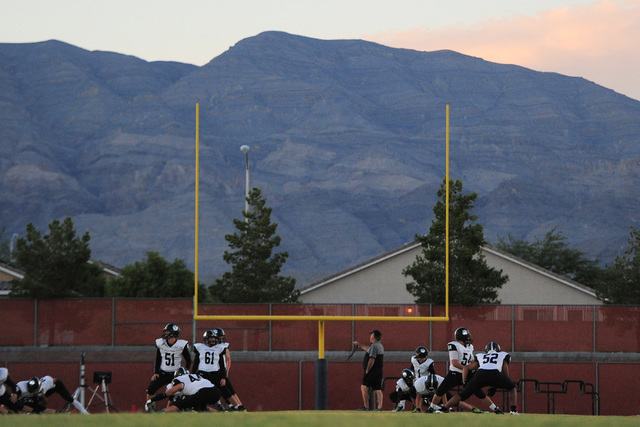 The Palo Verde football team warms up before the Legacy High School Palo Verde High School a ...