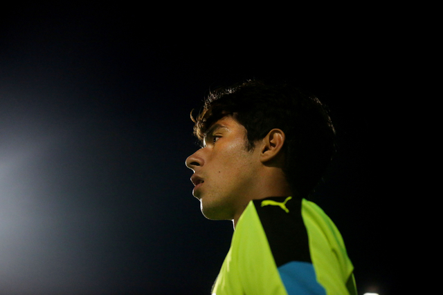 Coronado Cougars soccer team goalkeeper, Harrison Skinner, watches from field from the net a ...