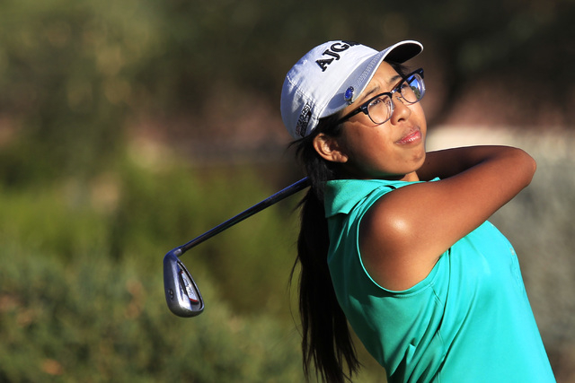Mercedes Khumnark tees off during the Sunrise Region girls golf tournament at Anthem Country ...