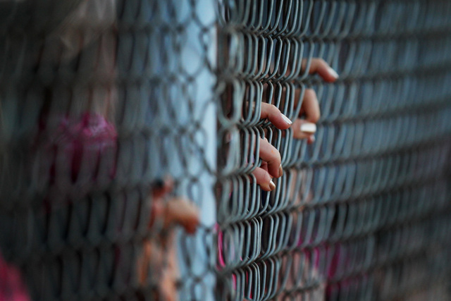 Foothill players hold on the the dugout fence during their Sunrise Region softball tournamen ...